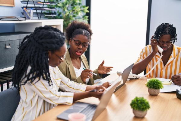 african-american-friends-business-workers-sitting-table-working-office_839833-15846